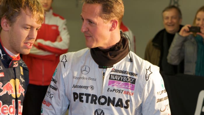Michael Shumacher alongside Sebastian Vettel